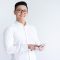 smiling-asian-man-using-tablet-computer_1262-18324